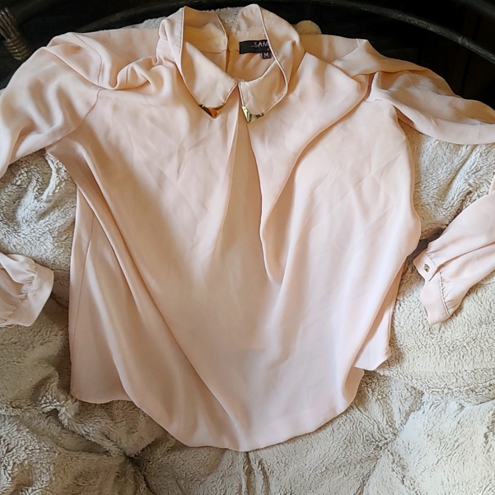 Tan blouse with metal accents